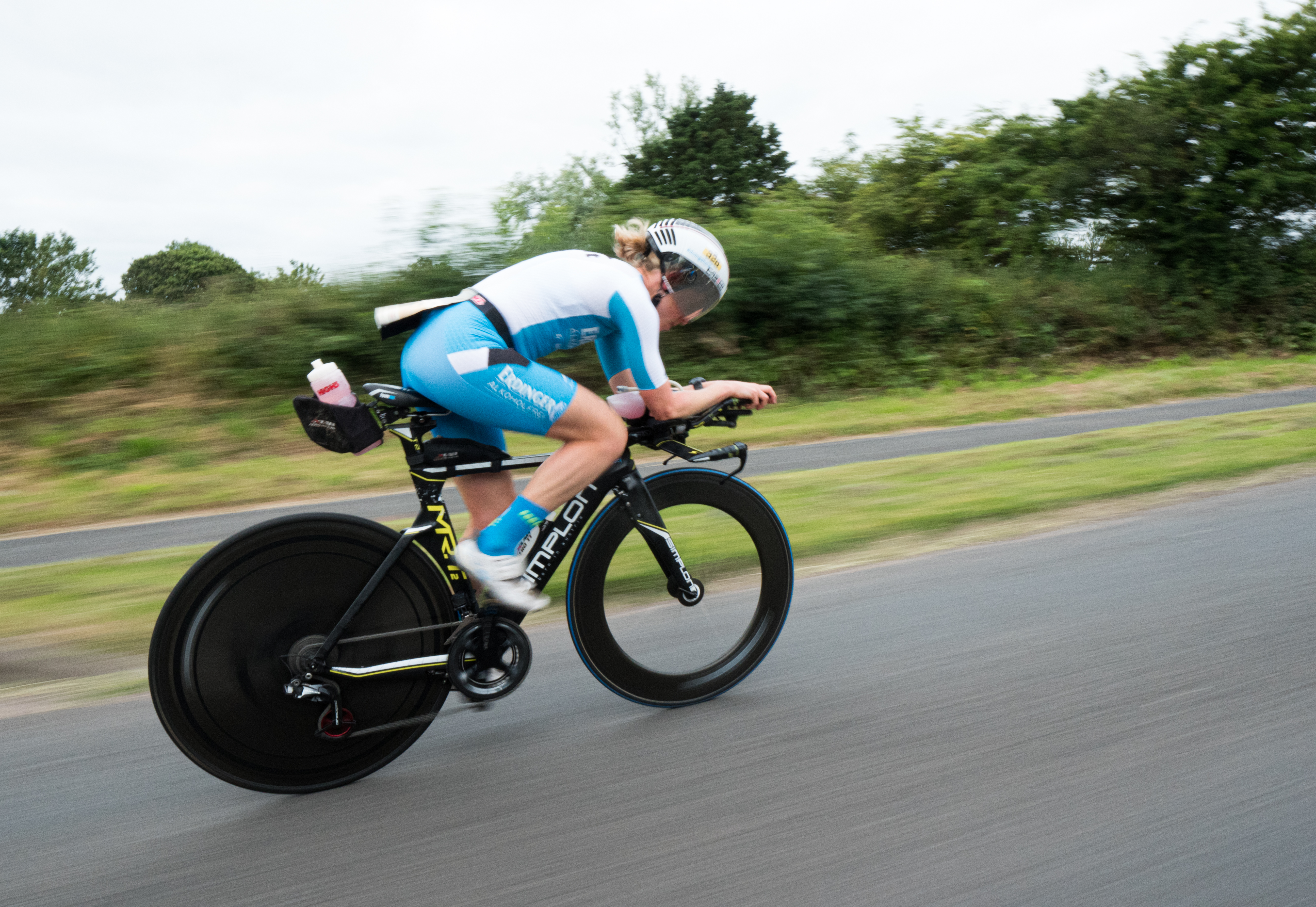 How does riding a TT Bike differ from a road bike